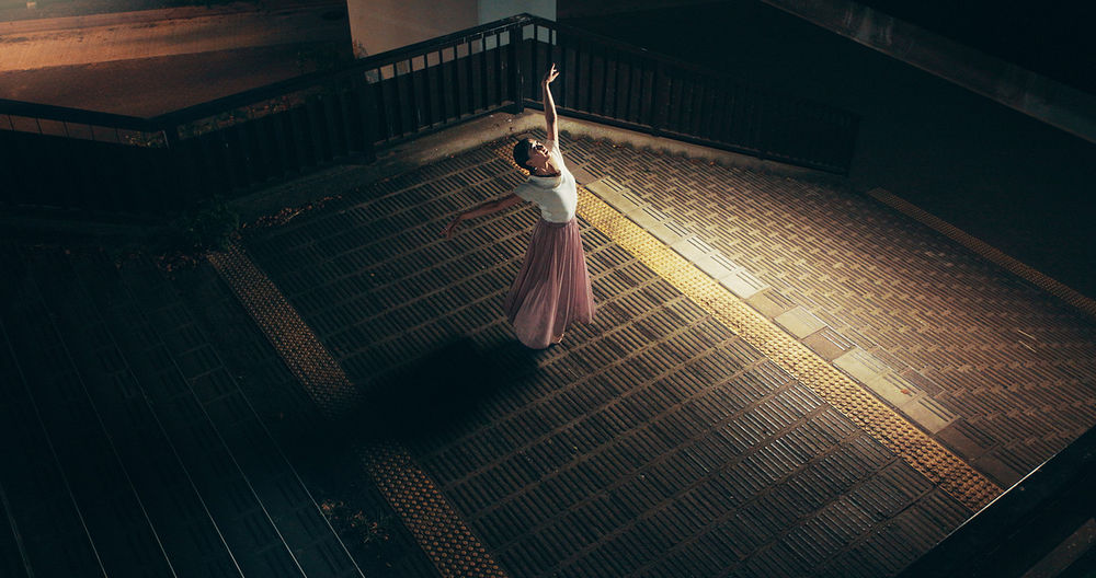 Japanese woman, outdoor and ballerina as dancer for practice, training and choreography at night. Female person, technique and rehearsal with ballet dancing for company, theater and performance art